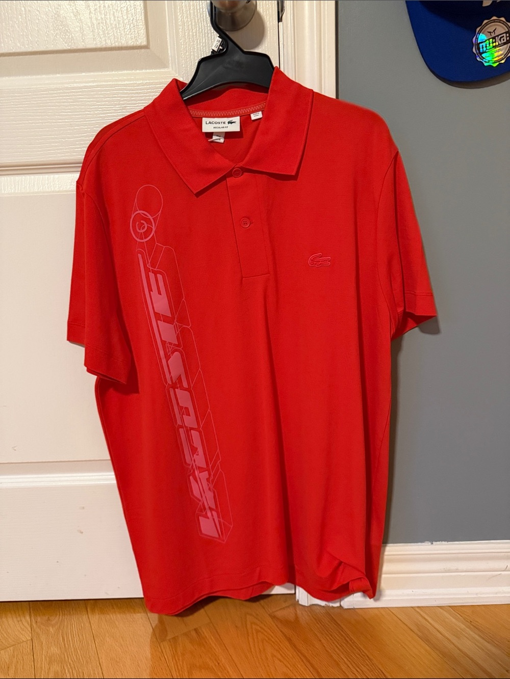 Lacoste Orange Men’s Polo with Vertical Graphic